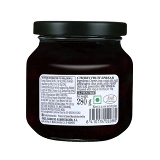 Jar of cherry fruit spread with label on a white background
