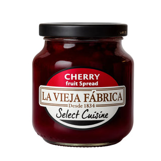 Jar of cherry fruit spread with 'La Vieja Fábrica' label on a white background