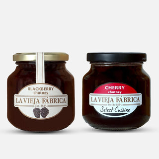 Two jars of La Vieja Fábrica chutney, one blackberry and one cherry, on a white background.